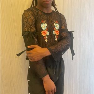 black lace top with floral appliqué